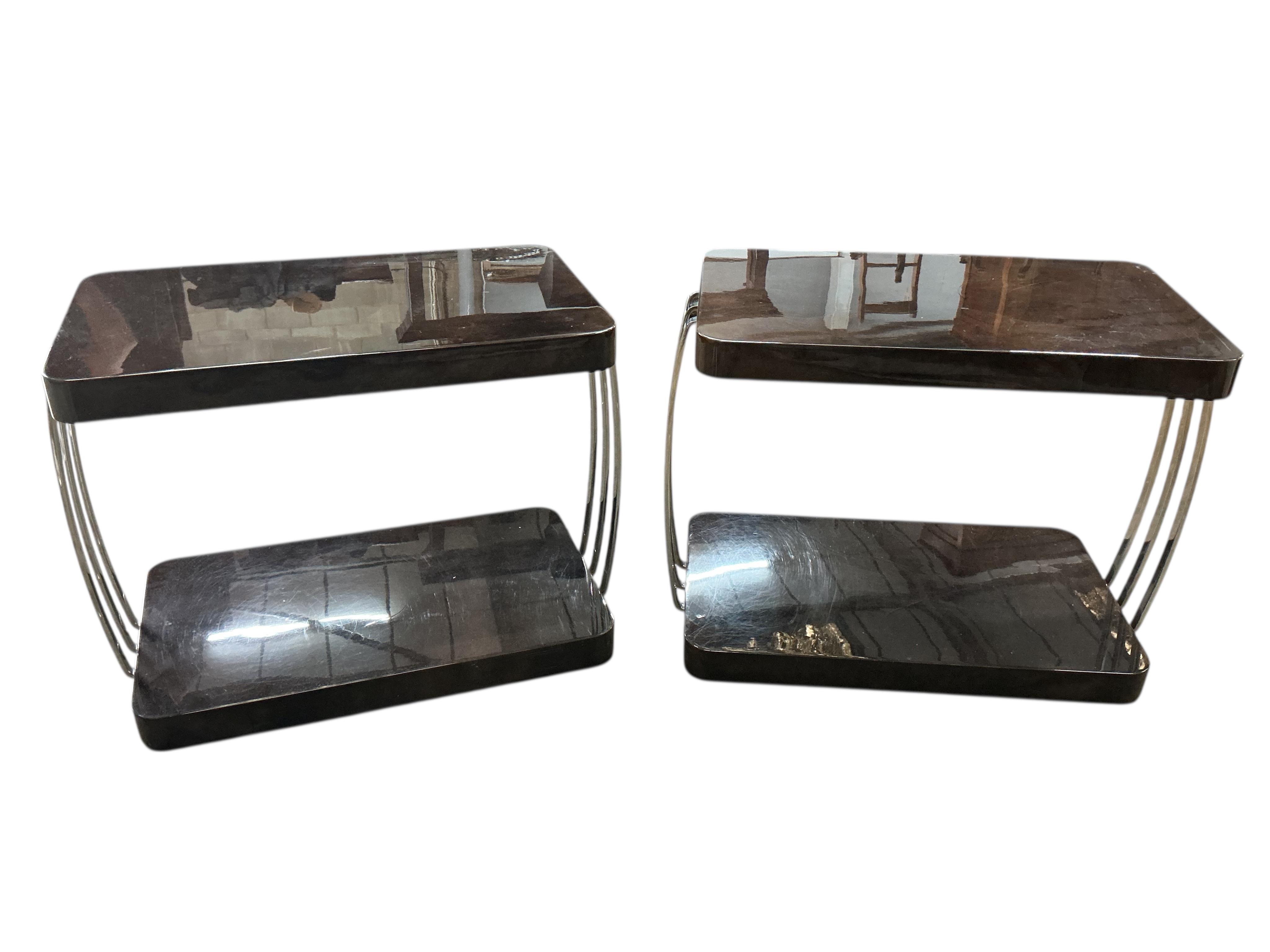 Sally Sirkin Lewis for J Robert Scott, a pair of rectangular Art Deco style lacquer and chrome two tier tables, width 84cm, depth 51cm, height 66cm